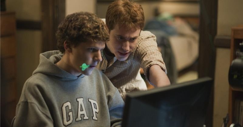 Two men looking at a computer